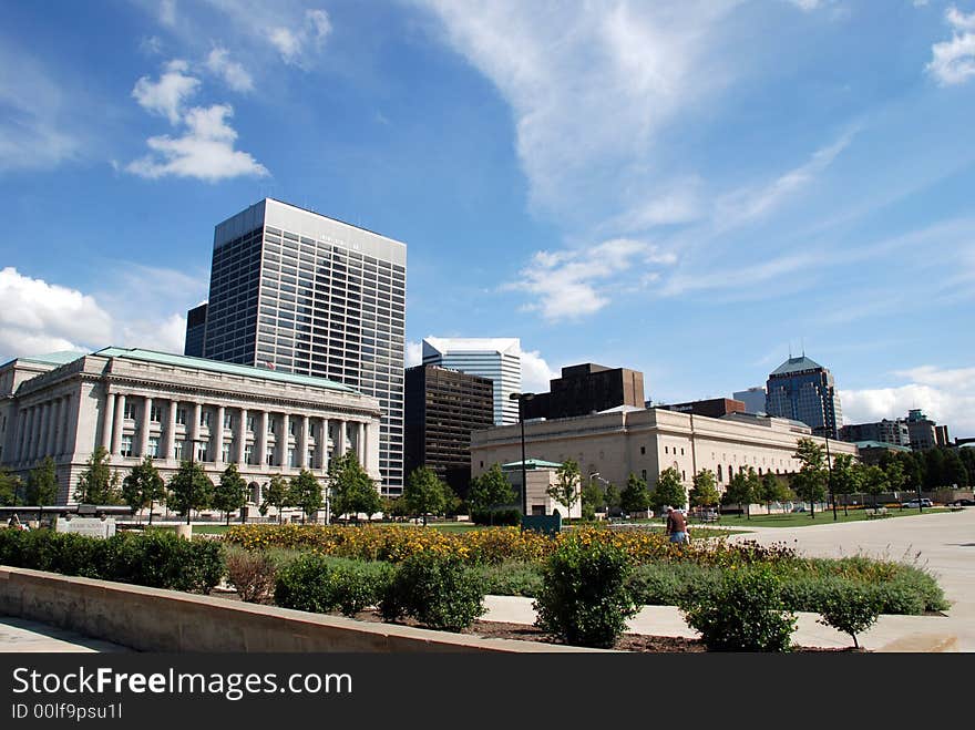 A modern building beside an older building in the city. A modern building beside an older building in the city