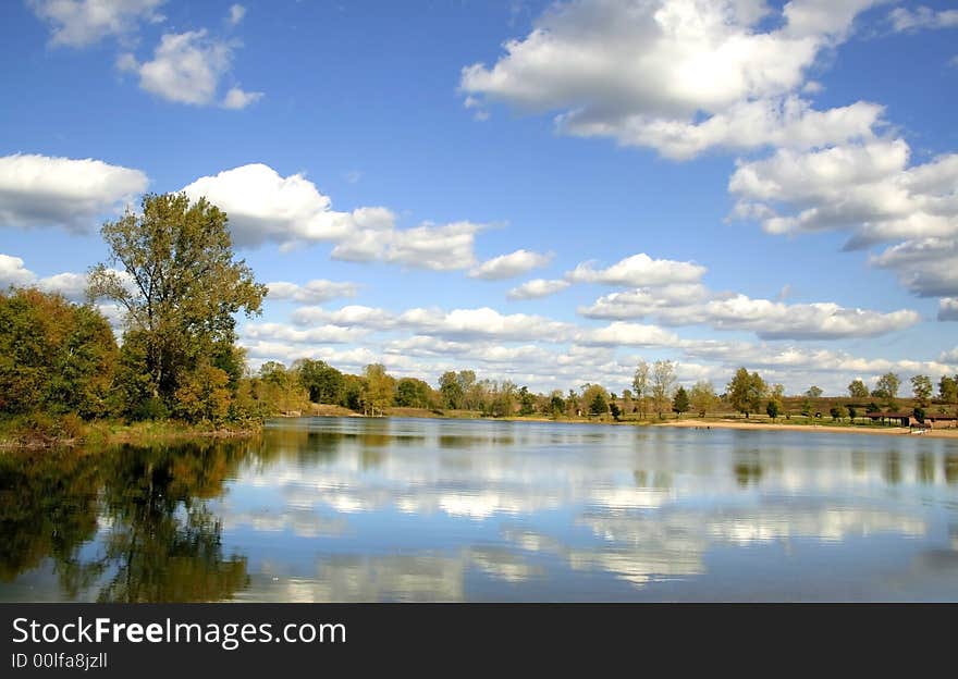 Tree and clouds reflection in the lake. Tree and clouds reflection in the lake