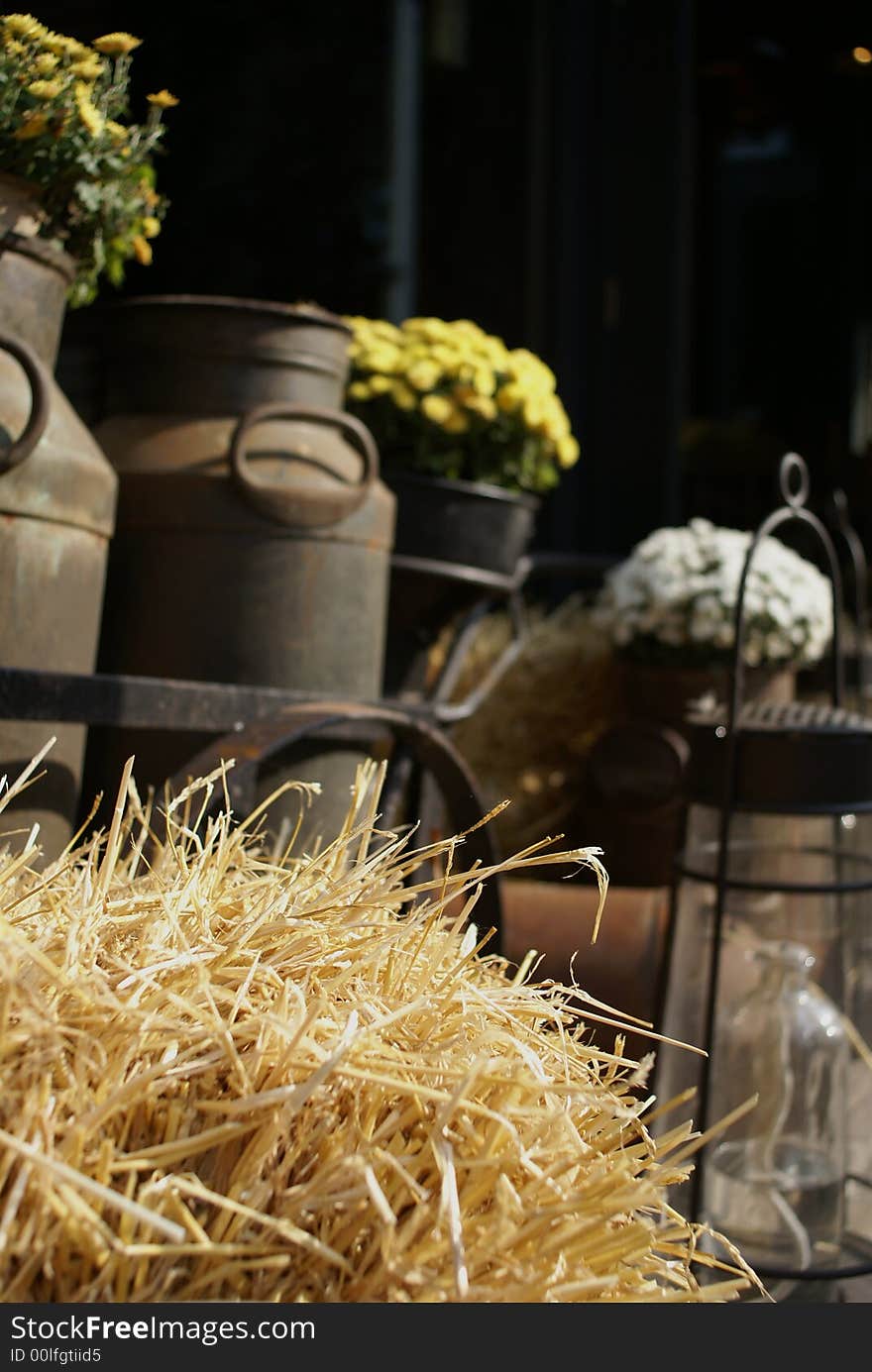 Straw with old milk-cans in the back. Straw with old milk-cans in the back.