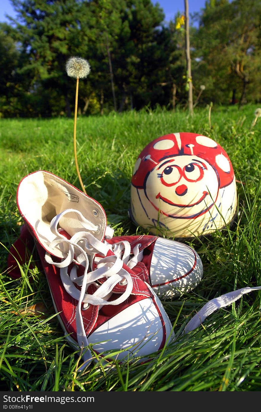 Shoes And Helmet On Grass