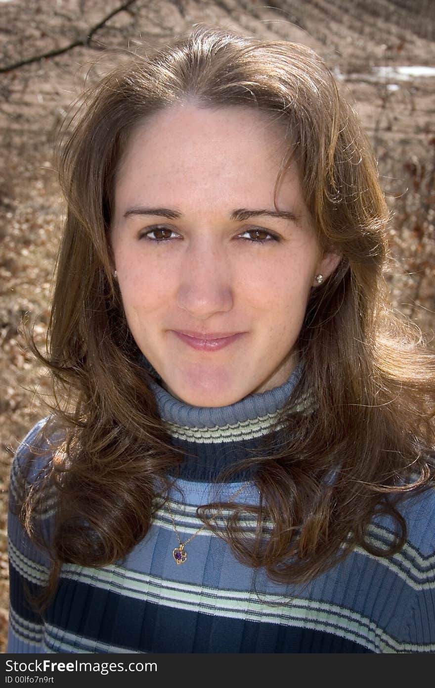 A head shot of a girl with beautiful brown eyes