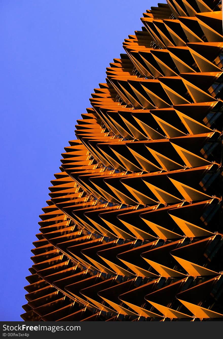 Abstract created from some elements of the Singapore Esplanade Theater roof when it is glowing bronze and yellow in the setting sun. Abstract created from some elements of the Singapore Esplanade Theater roof when it is glowing bronze and yellow in the setting sun