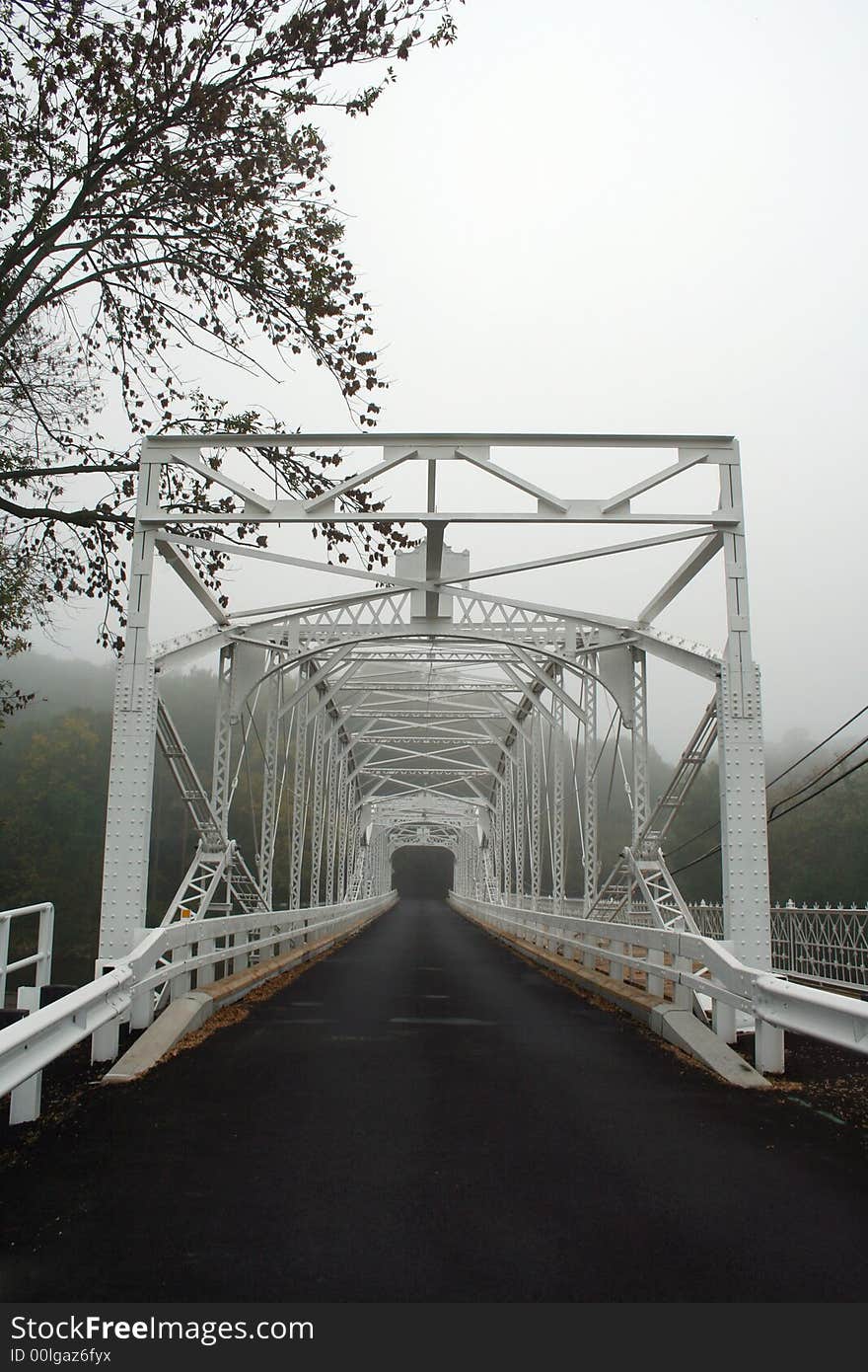 An Old white single lane bridge. An Old white single lane bridge