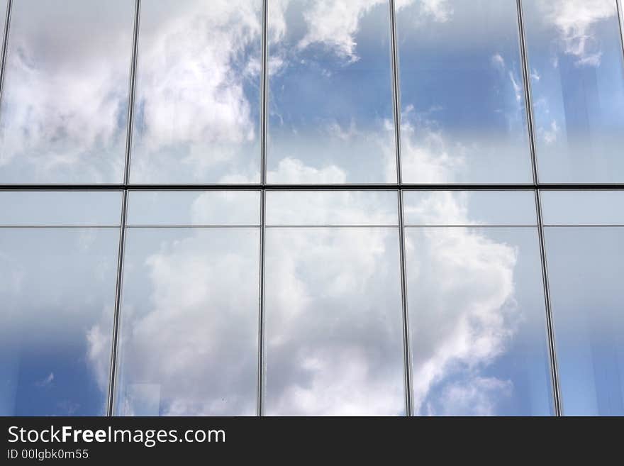 Cloud reflections on glass office building. Cloud reflections on glass office building