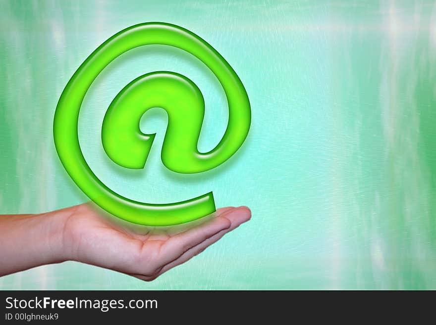 E-mail concept on a palm in front of a green background. E-mail concept on a palm in front of a green background