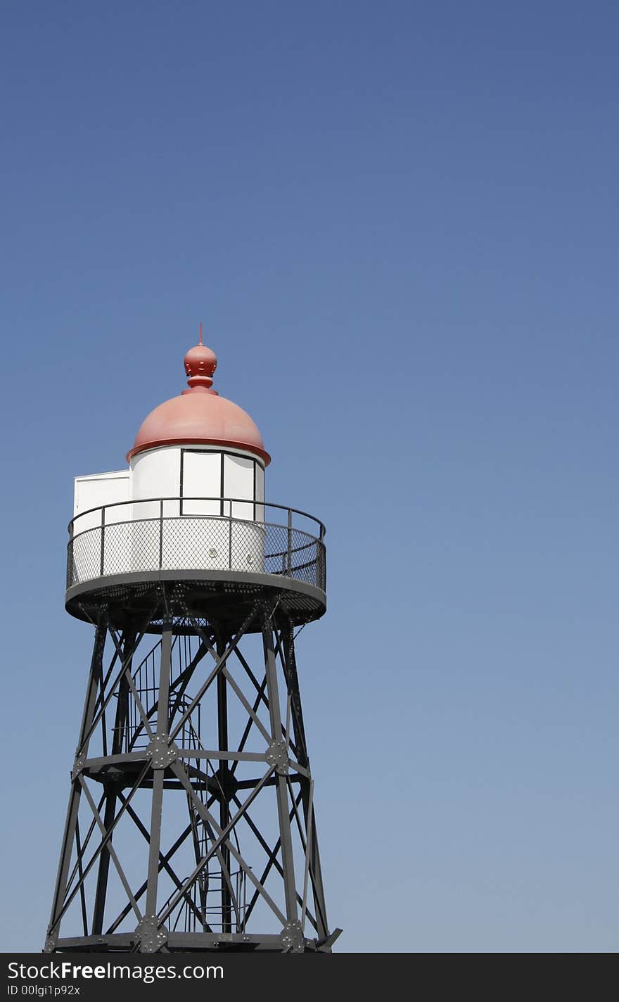 Small lighthouse at ocean shore