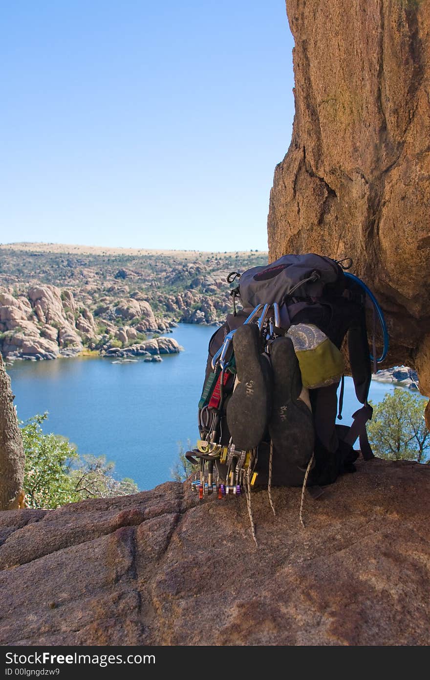 A backpack loaded down with climbing gear sits on the edge of a wonderful view of Watson Lake, Prescott, AZ. A backpack loaded down with climbing gear sits on the edge of a wonderful view of Watson Lake, Prescott, AZ.