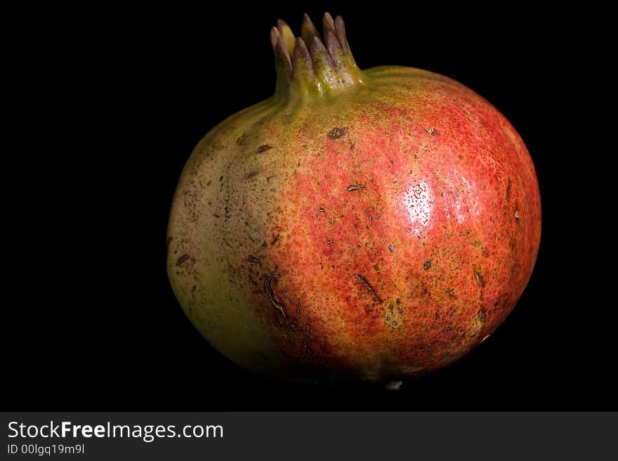 Pomegranate isolated on black background.