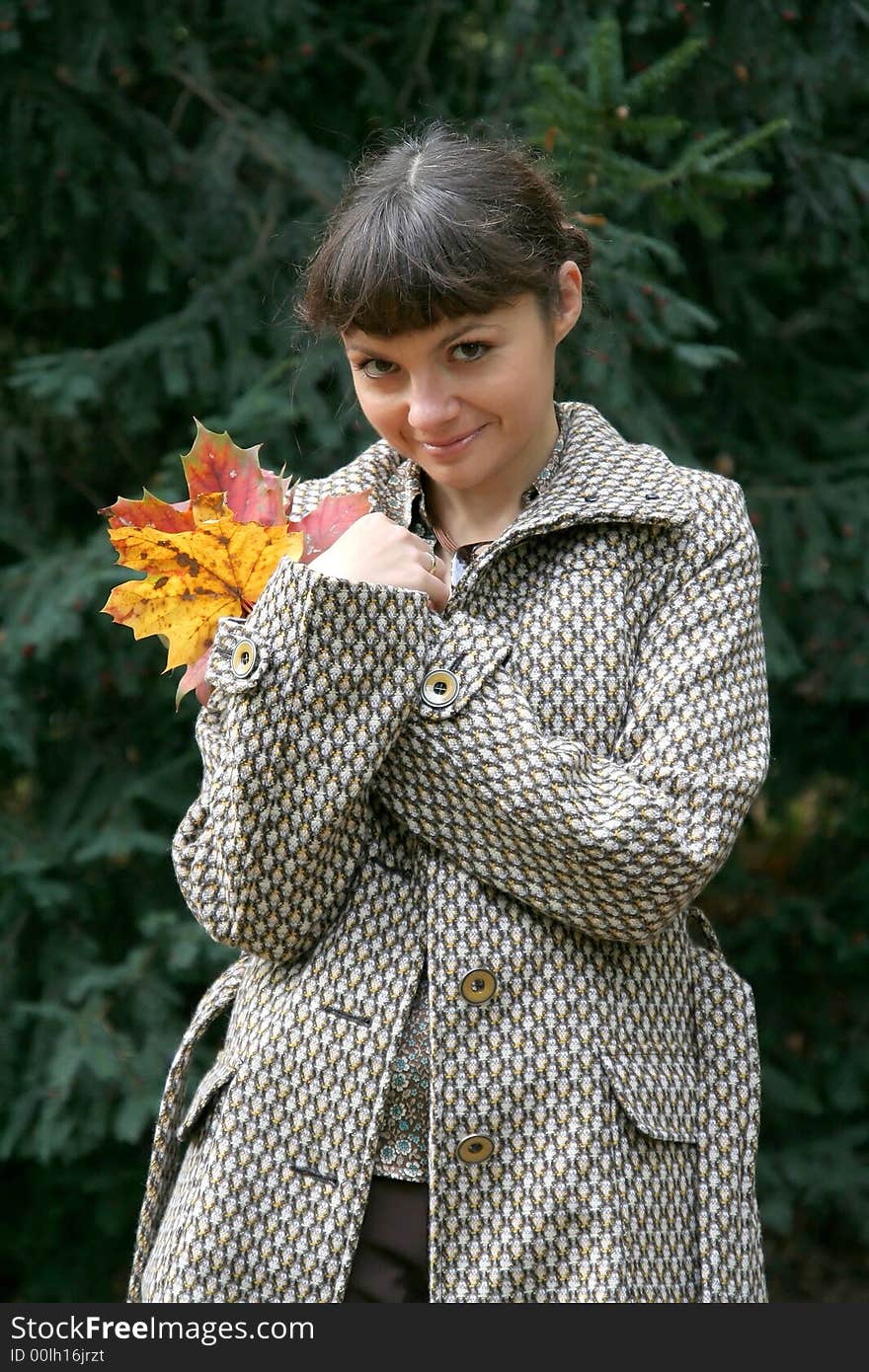 Beautiful woman walking in the autumn park. Beautiful woman walking in the autumn park