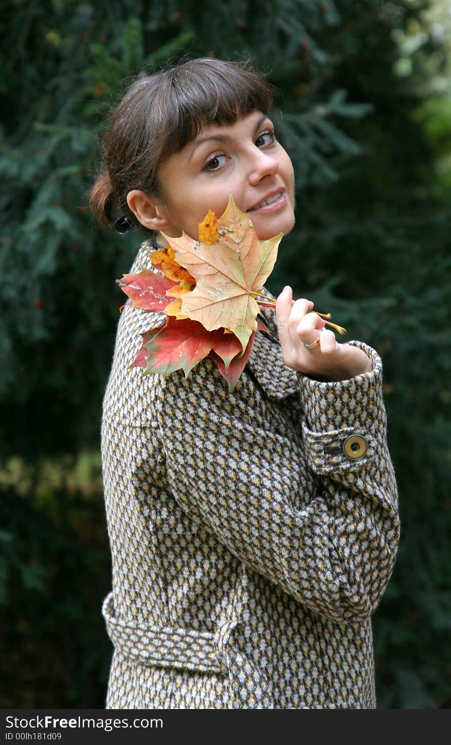 Beautiful woman walking in the autumn park. Beautiful woman walking in the autumn park