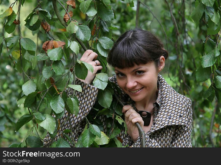 Beautiful woman walking in the autumn park. Beautiful woman walking in the autumn park