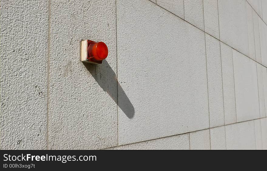 Alarm light on a concrete wall. Alarm light on a concrete wall