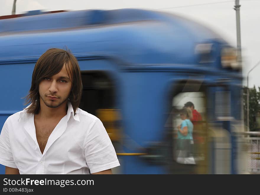 Man in a metro station with blured by motion train on the background. Man in a metro station with blured by motion train on the background