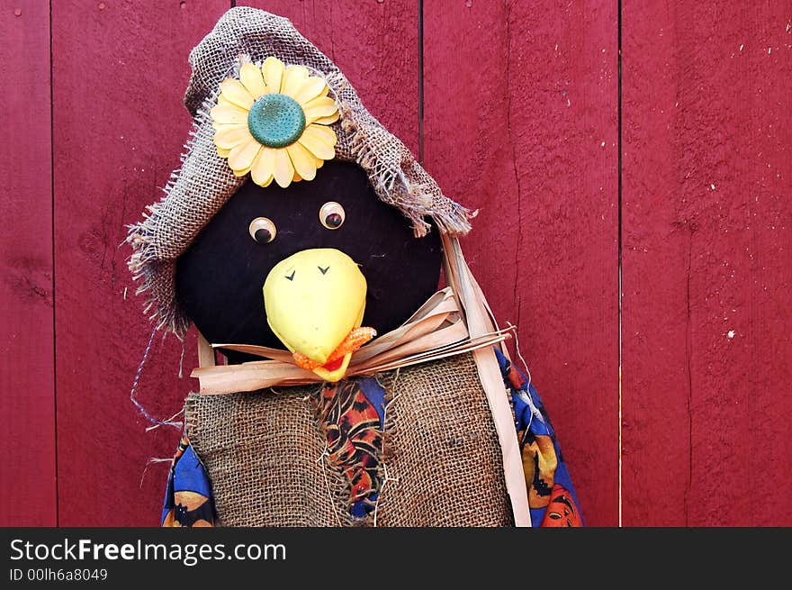 A scarecrow decoration for the fall harvest or Halloween