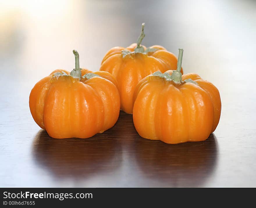 3 Pumpkins over a blur background. 3 Pumpkins over a blur background