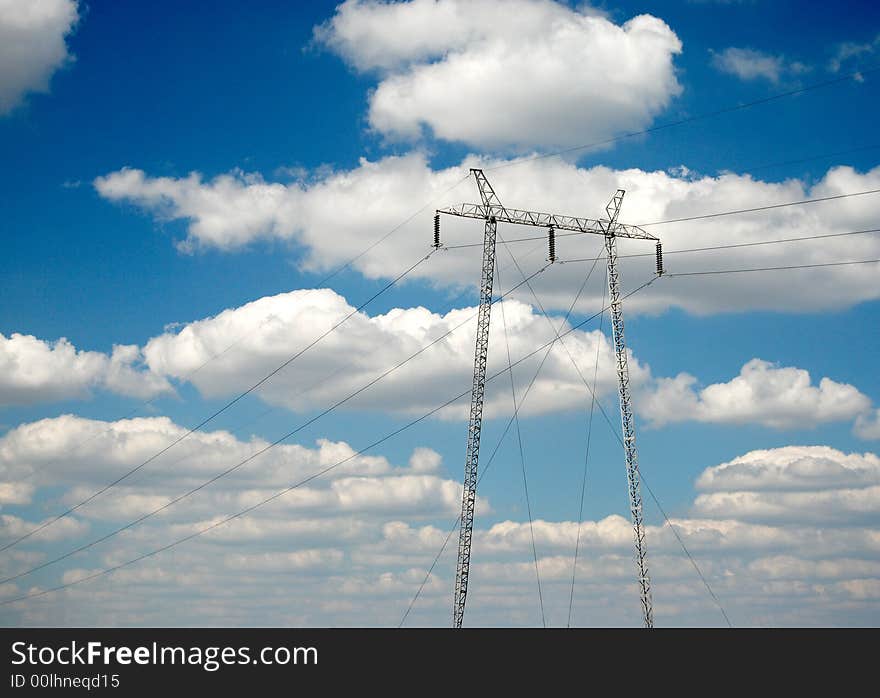 High voltage electricity pylon over blue sky and white clouds. High voltage electricity pylon over blue sky and white clouds