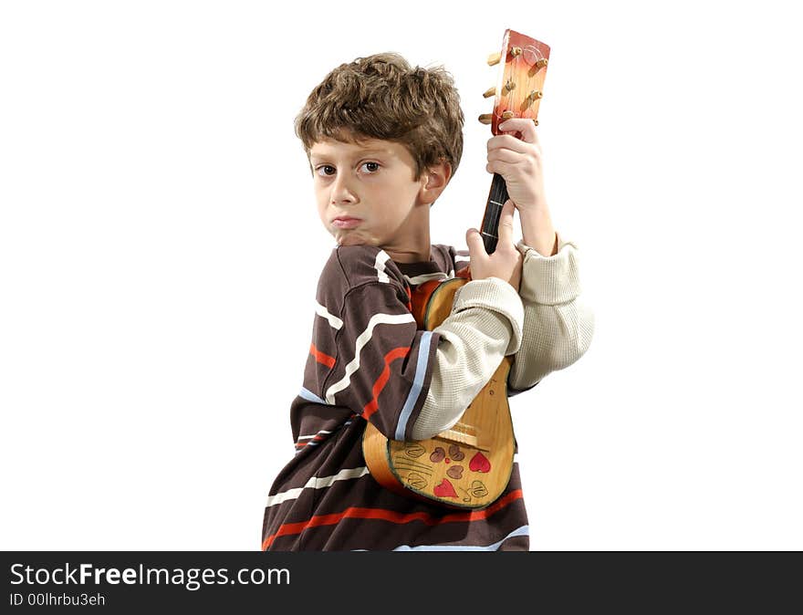 Photo of a Child Holding a Musical Instrument / Ukulele - Music Related