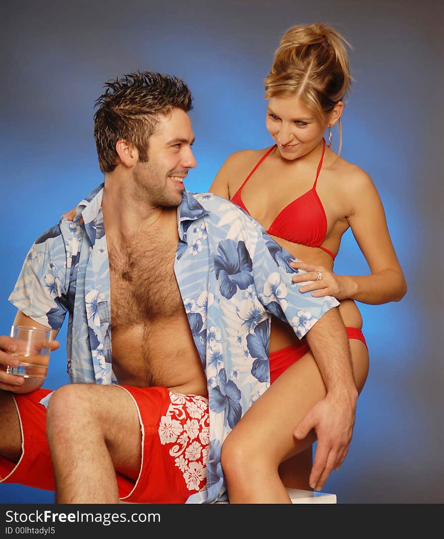 A young sexy pair in beach clothes. A young sexy pair in beach clothes