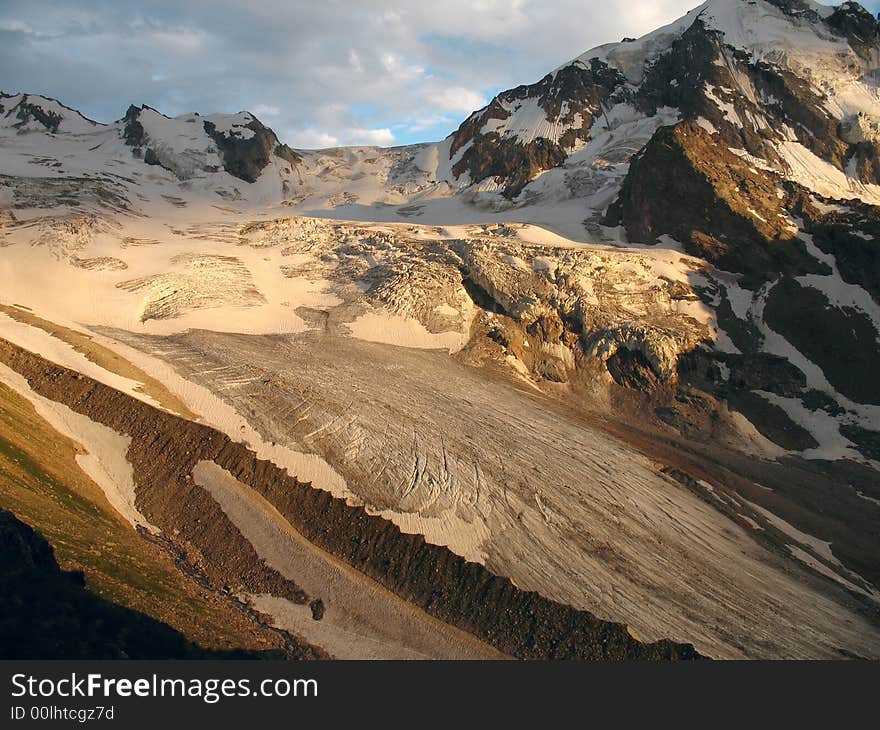 Landscape with high mountains, snowy peaks and blue sky. Landscape with high mountains, snowy peaks and blue sky