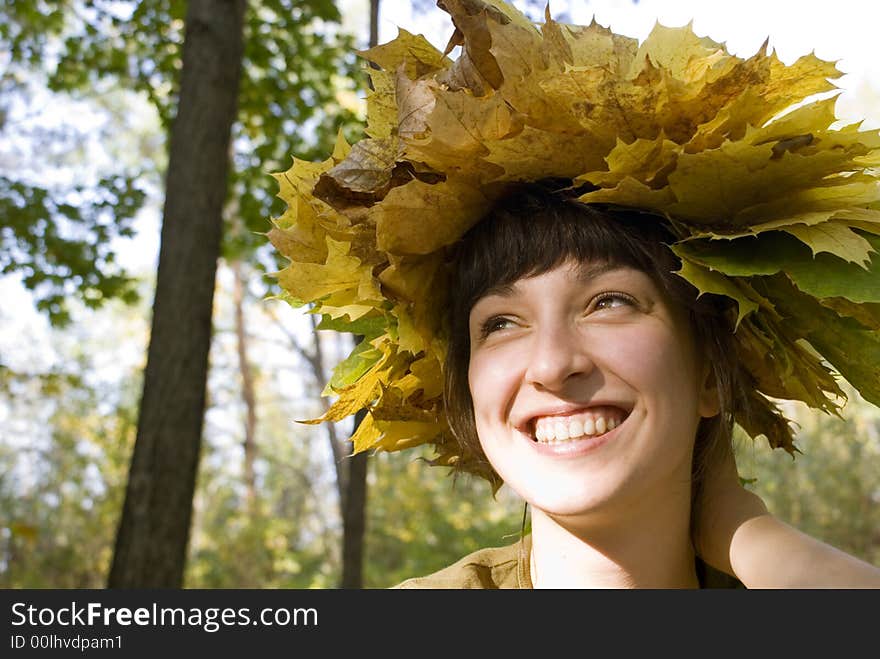 Beautiful girl with wreath of leaves. Beautiful girl with wreath of leaves