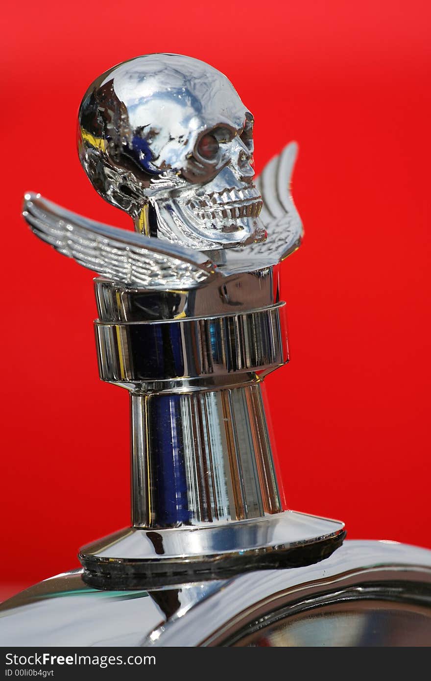 Cool skull and wings decorative radiator cap on a hot rod at a car show in Kansas.