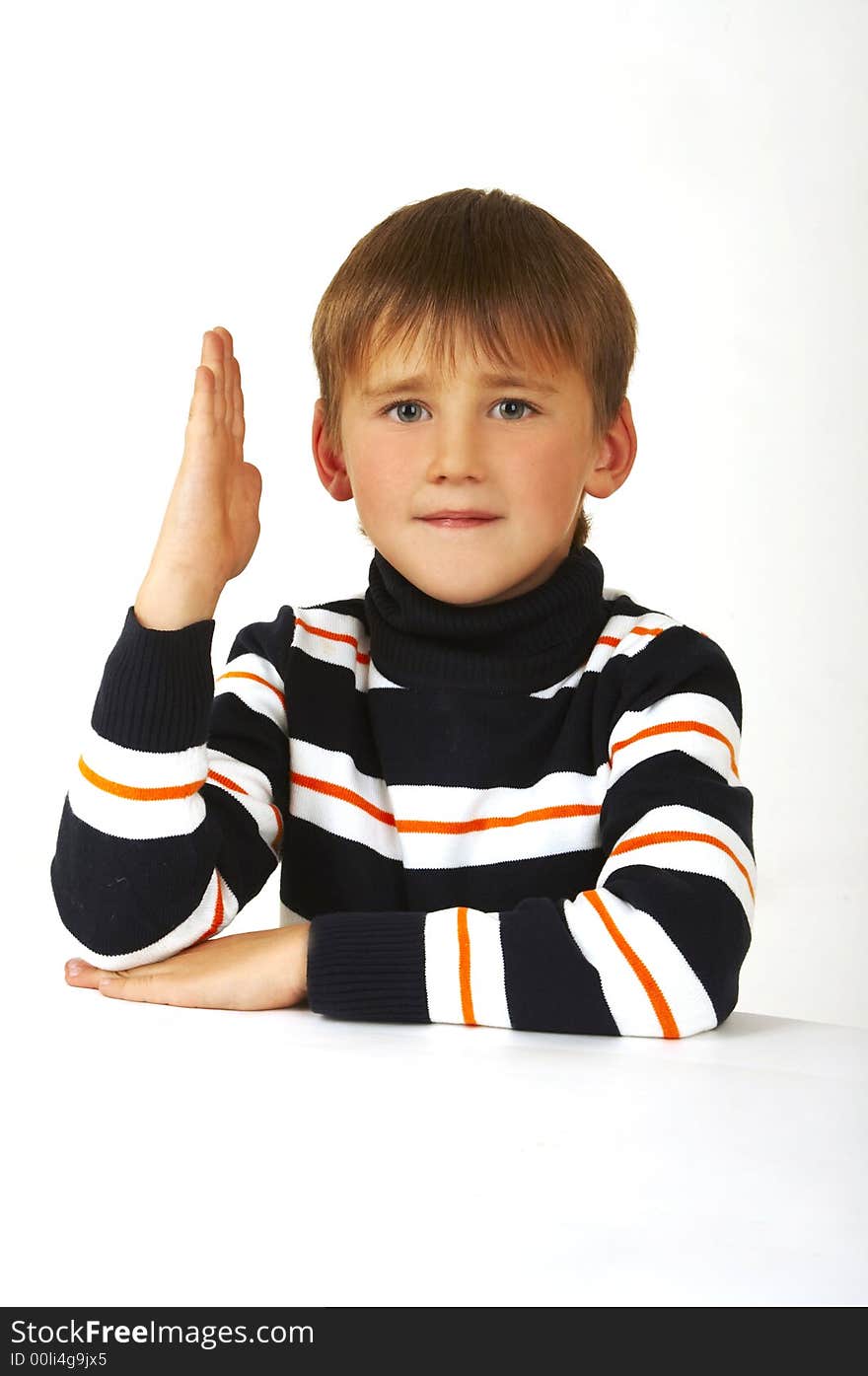 The boy in a striped golf on a white background