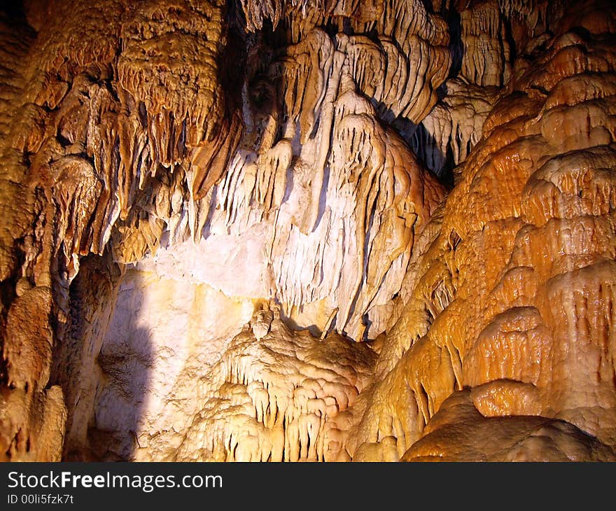 Stalactite and stalagmite in large grotto