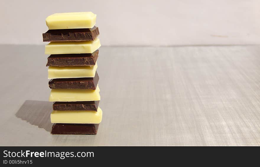 Pieces of white and dark chocolate