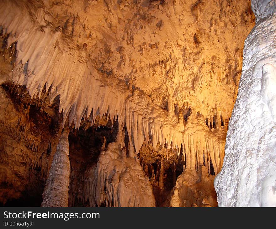 Stalactite and stalagmite in large grotto