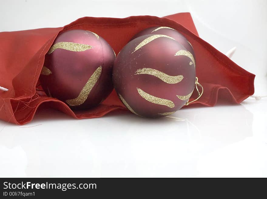 Red Christmas tree decorations on red satin. Red Christmas tree decorations on red satin.