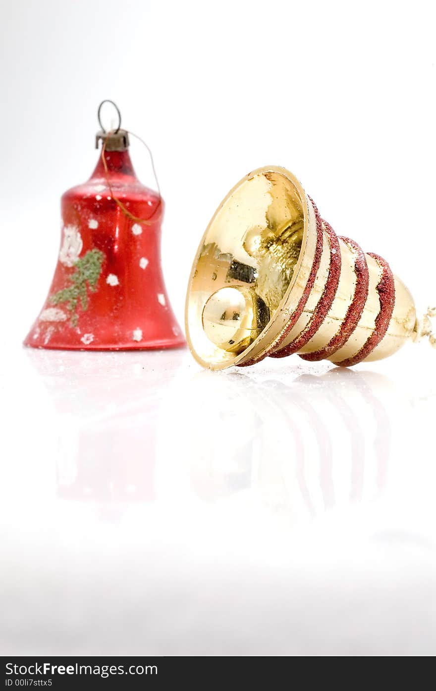 Christmas tree decoration bell on white background. Golden one.