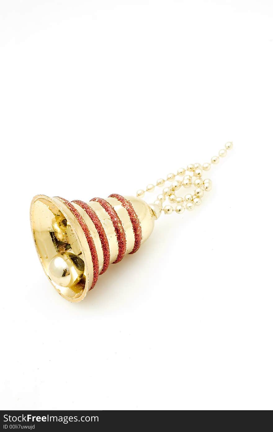 Christmas tree decoration bell on white background. Golden one.