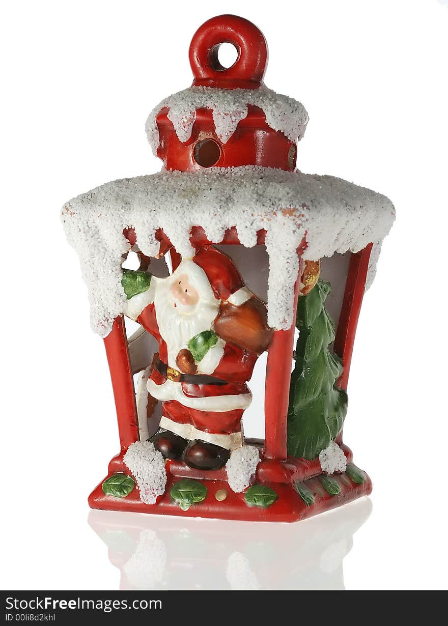 Christmas toy. A toy on a fur-tree with porcelain Santa Claus and fir - tree