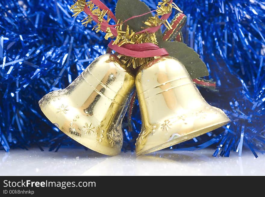 Blue Christmas tree decoration with golden bells.