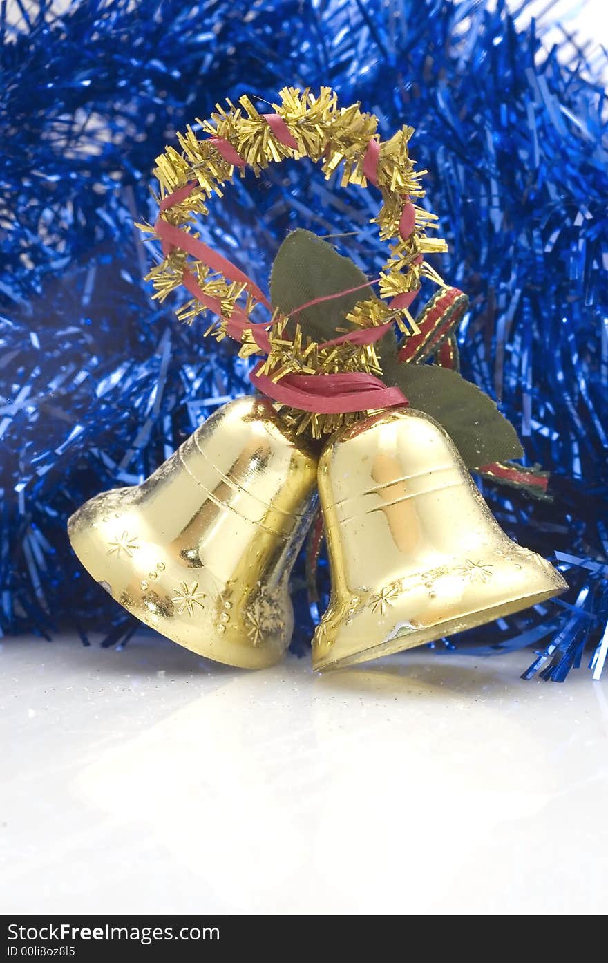 Blue Christmas tree decoration with golden bells.