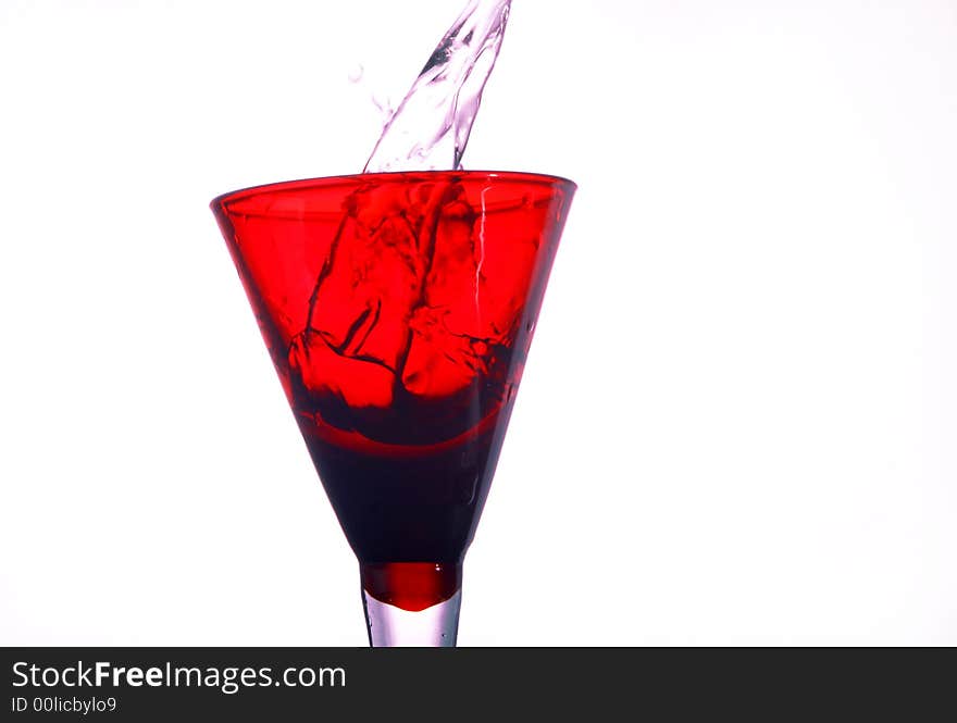 A red glass full of water