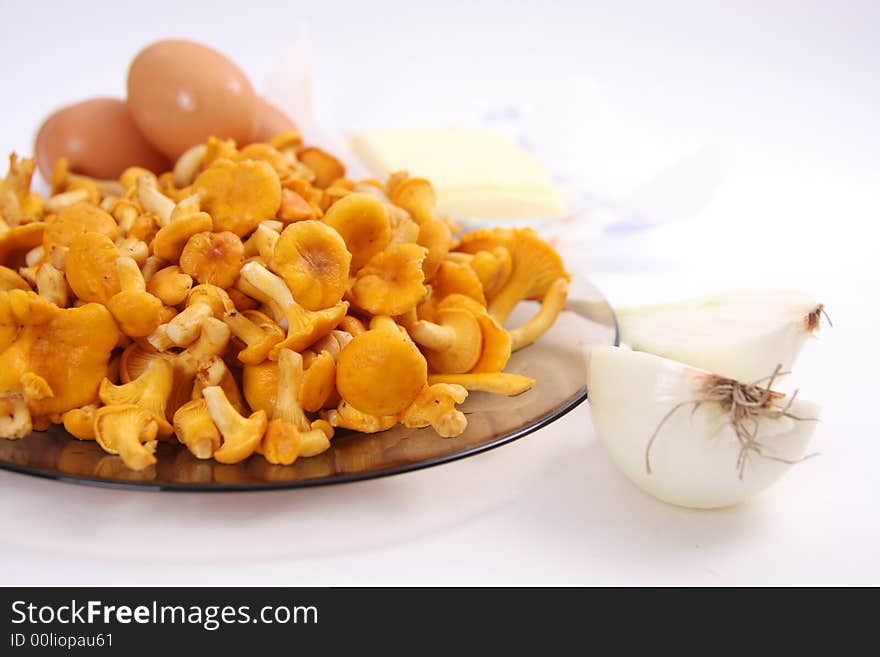 Chanterelle on plate and eggs