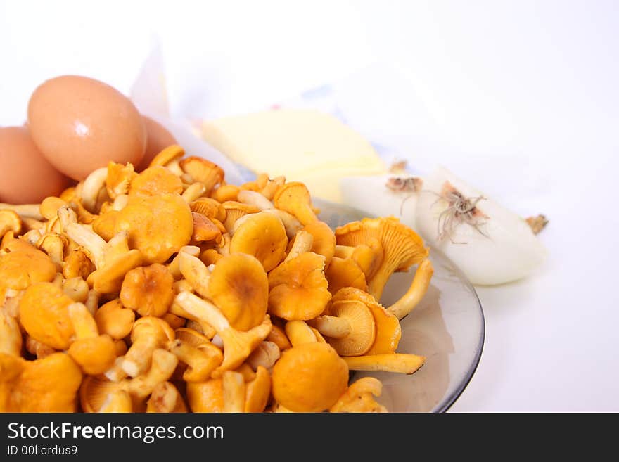 Chanterelle on plate and eggs