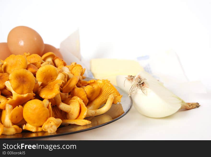 Chanterelle on plate and eggs