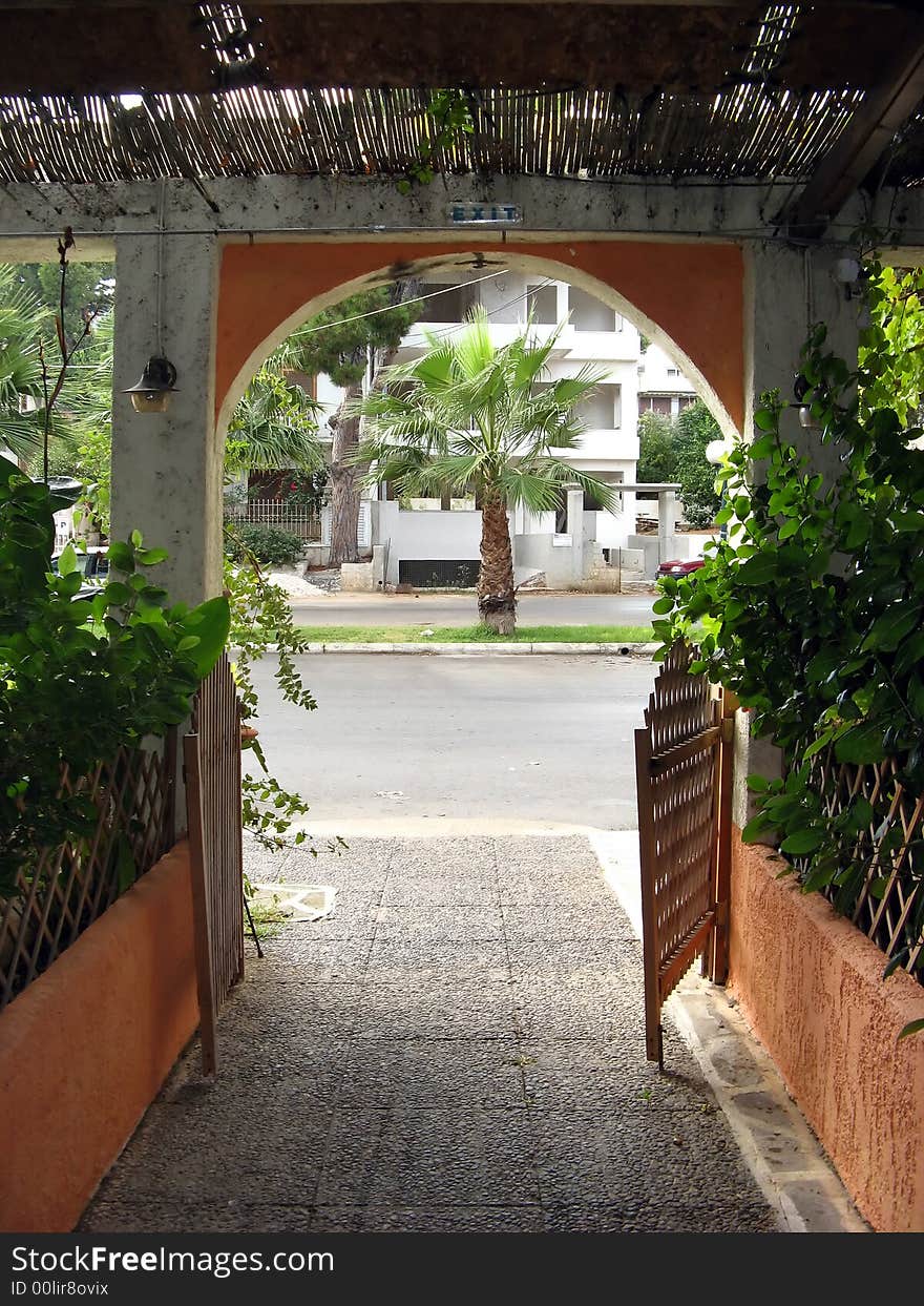 A pathway exit with plants and wooden details