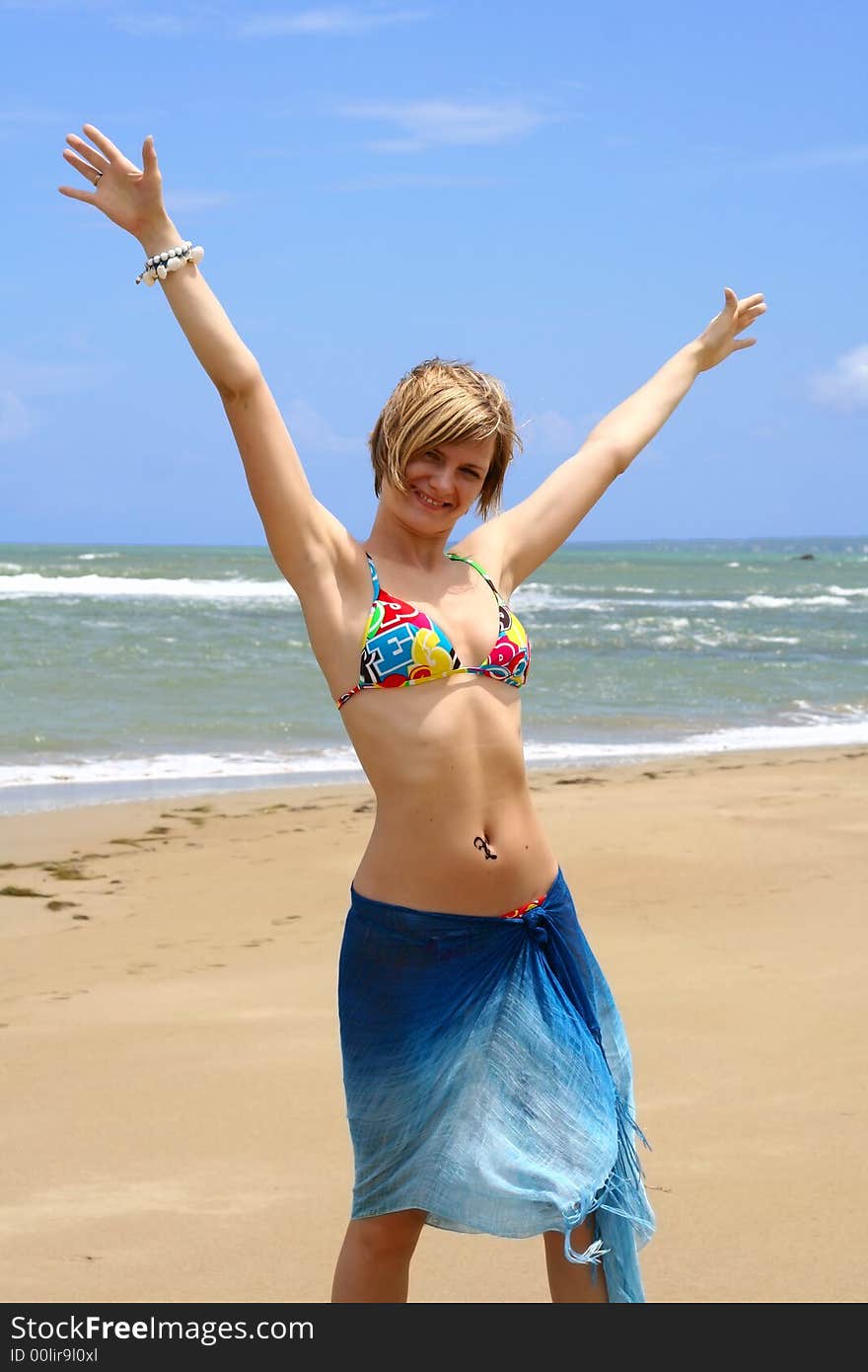 Young model at white sandy beach. Young model at white sandy beach