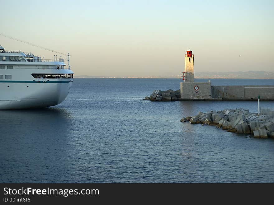 Passenger ship from Corsica arriving in the harbor of Nice at sunset. Passenger ship from Corsica arriving in the harbor of Nice at sunset