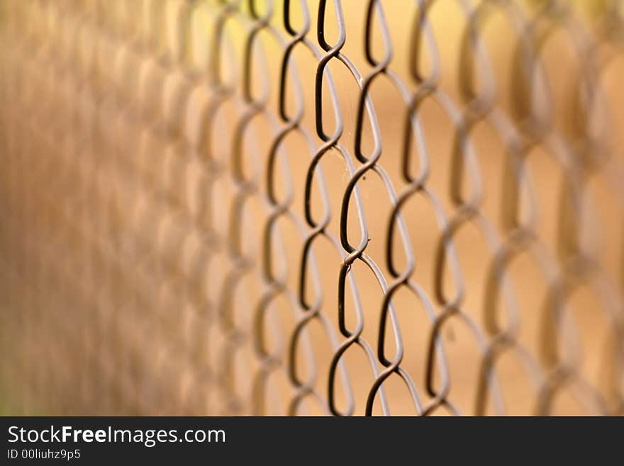 Wire netting on brown background - depth of field. Wire netting on brown background - depth of field