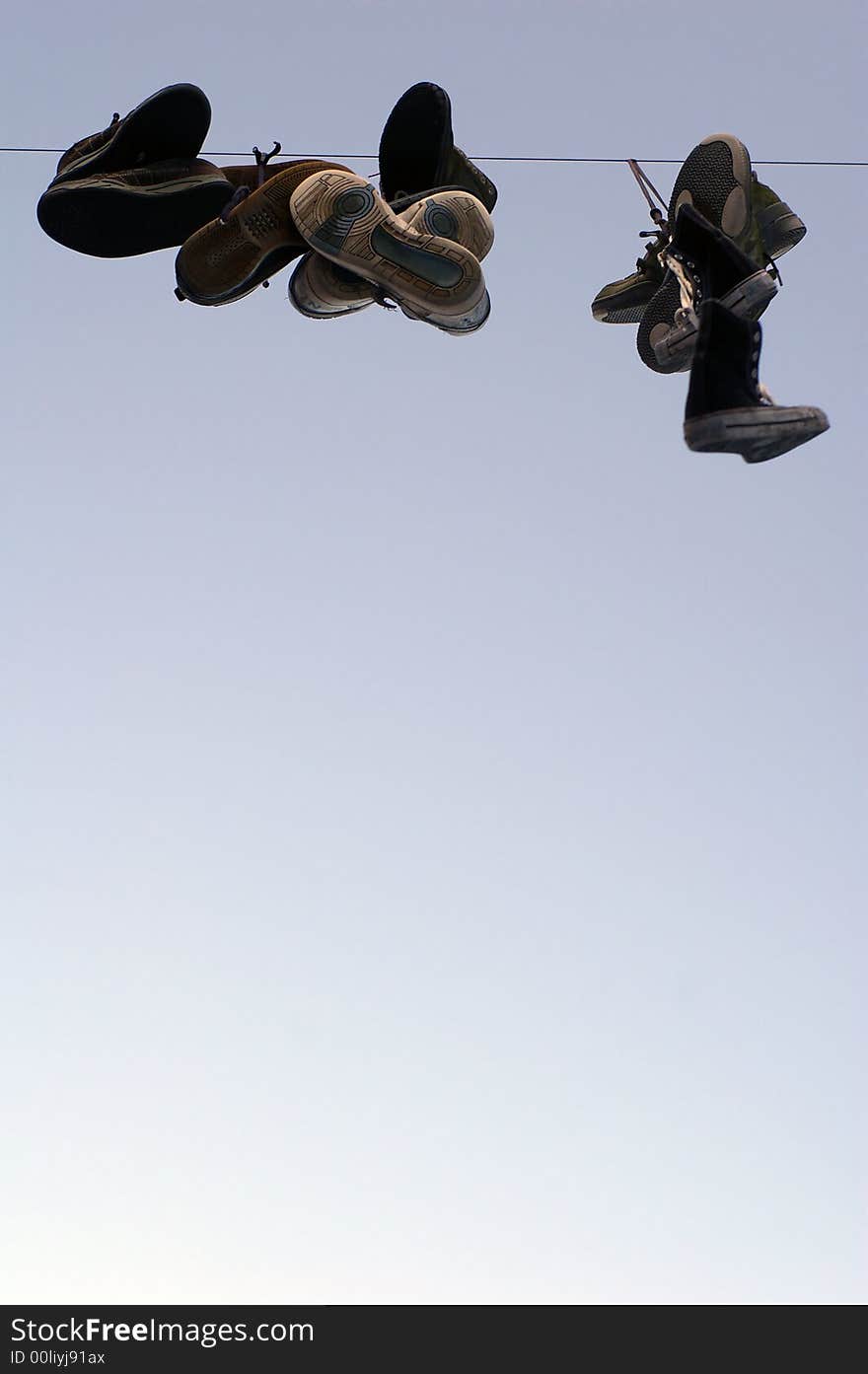 Shoes hanging on a cable