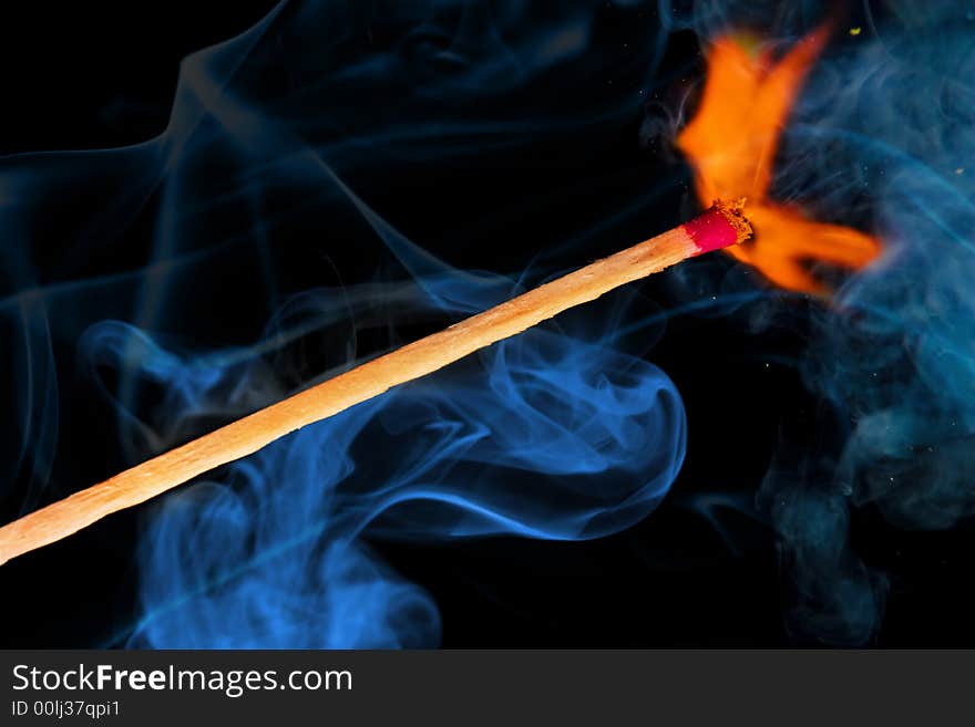 Burning match and color smoke