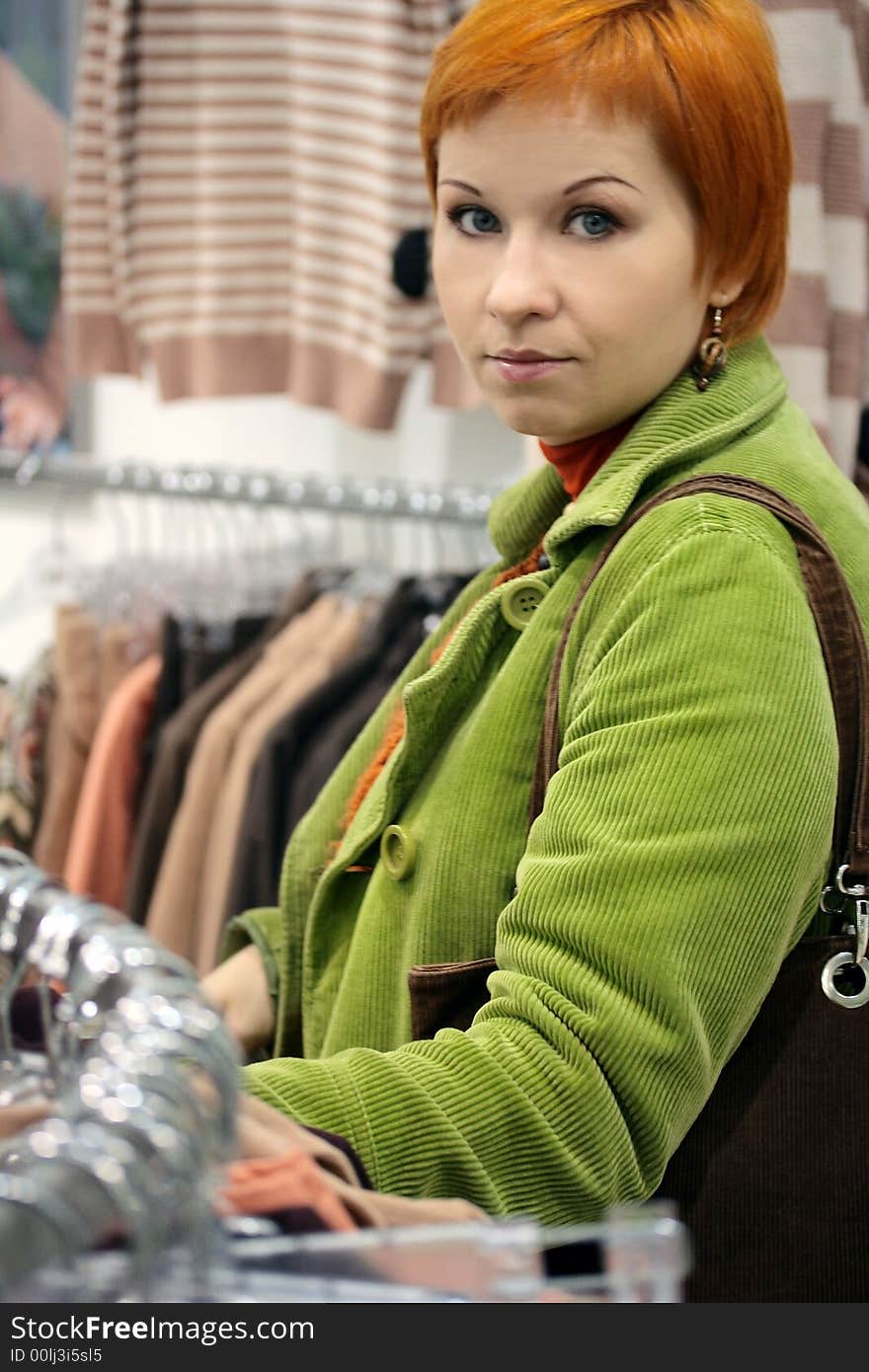 Red-haired woman in Clothes shop