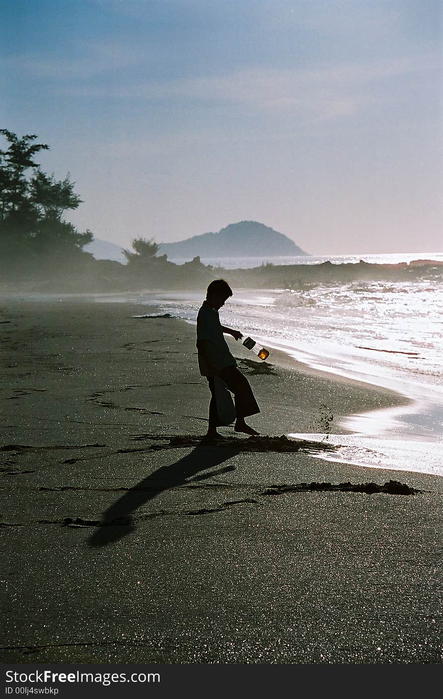 Boy shadow in the beach