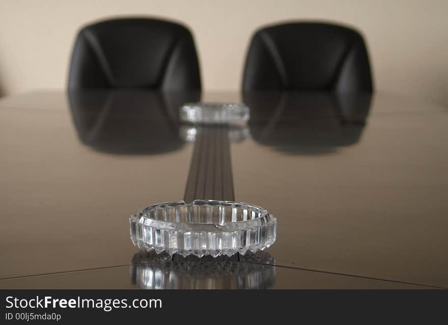 In the meeting room,a ashtray is on the table. In the meeting room,a ashtray is on the table.