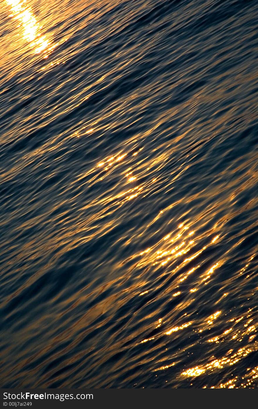 Warm sunset light caresses waves of the Mediterranian sea. Warm sunset light caresses waves of the Mediterranian sea