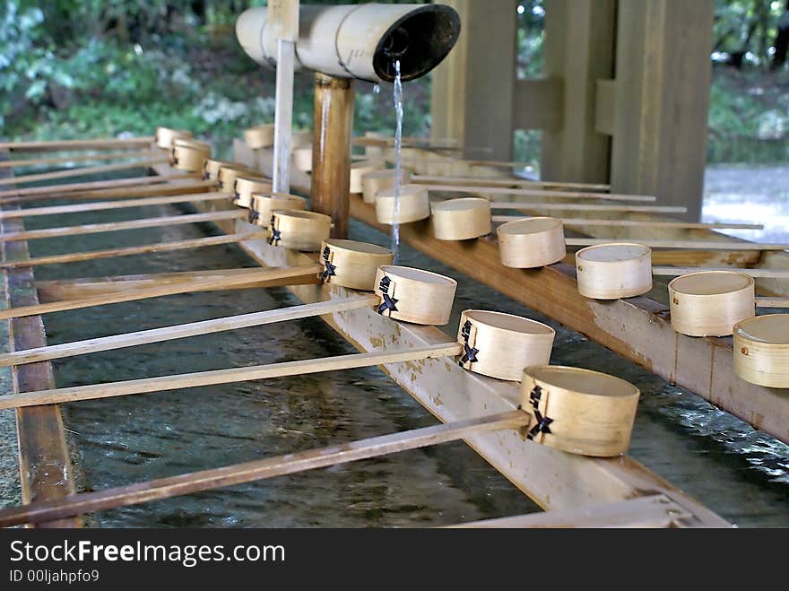 Wooden made cups are used by visitors of the Meiji Jingu Temple in Tokyo, Japan, to wash their hands and purify themselves before entering. Wooden made cups are used by visitors of the Meiji Jingu Temple in Tokyo, Japan, to wash their hands and purify themselves before entering.